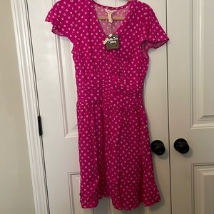 Pink and white knee length dress.